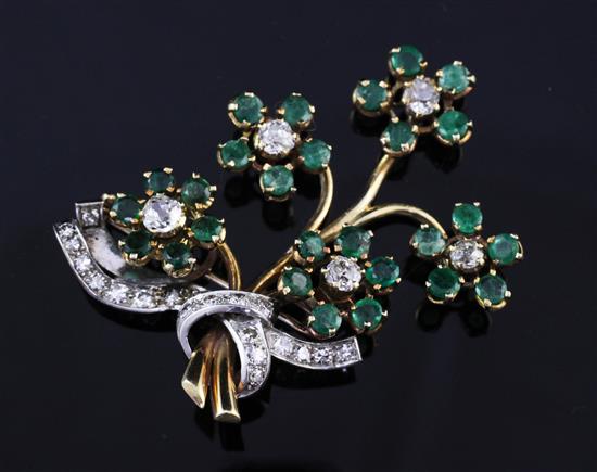 A gold, emerald and diamond floral spray brooch, 2in.